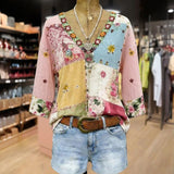 "Blusa Vintage com Estampa Floral" can be rewritten as "Blusa Retro com Design Floral".