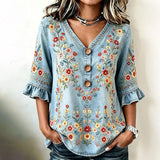 "Blusa Vintage com Estampa Floral" can be rewritten as "Blusa Retro com Padrão Floral".