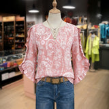 "Blusa Vintage com Estampa Floral" can be rewritten as "Camisa Vintage com Design Floral".