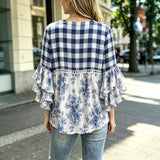 "Blusa Vintage com Estampa Floral" can be rewritten as "Camisa Vintage com Design Floral".