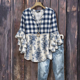 "Blusa Vintage com Estampa Floral" can be rewritten as "Camisa Vintage com Design Floral".