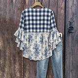 "Blusa Vintage com Estampa Floral" can be rewritten as "Camisa Vintage com Design Floral".