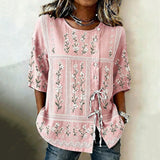 "Blusa Vintage com Estampa Floral" can be rewritten as "Camisa Vintage com Design Floral".